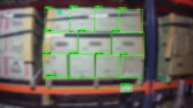 Rack camera view with boxes, pallets and bin labels detected