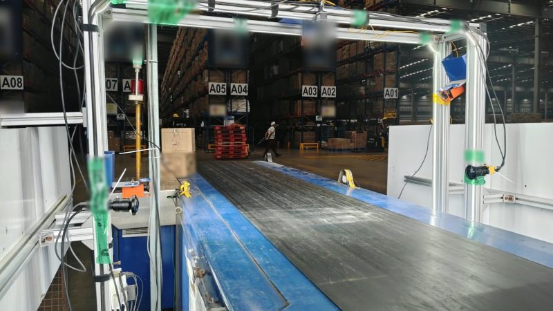 Camera arch over a warehouse loading conveyor