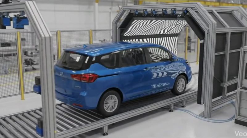 Concept render of a car passing through a camera inspection tunnel